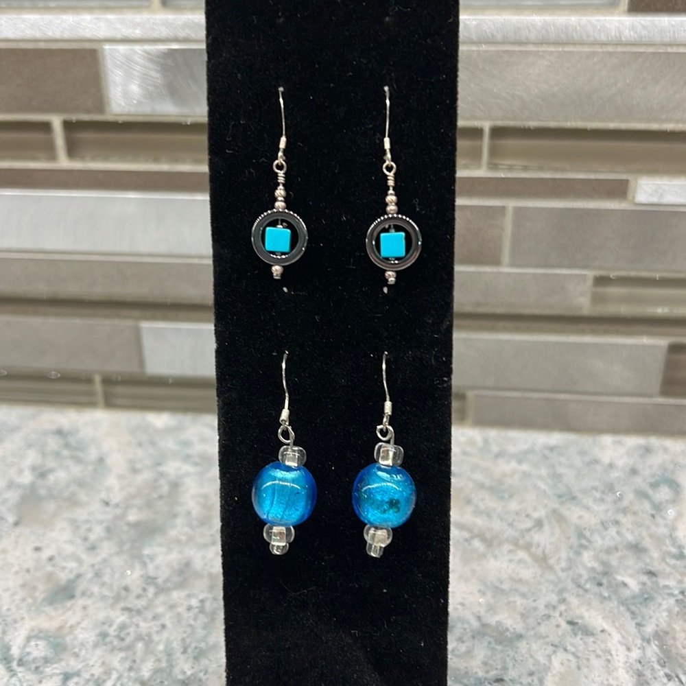 Two pairs of French hook beaded earrings.